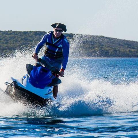 The owner riding a jet ski