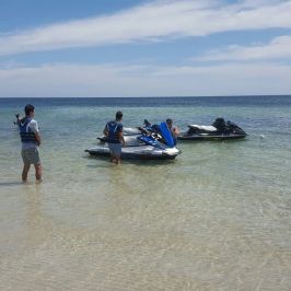 A few guests getting ready to get on their jet skis