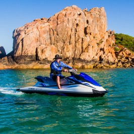 The owner sitting atop his jet ski