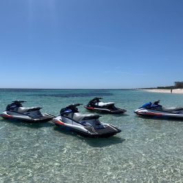 a group of people in a boat on a body of water